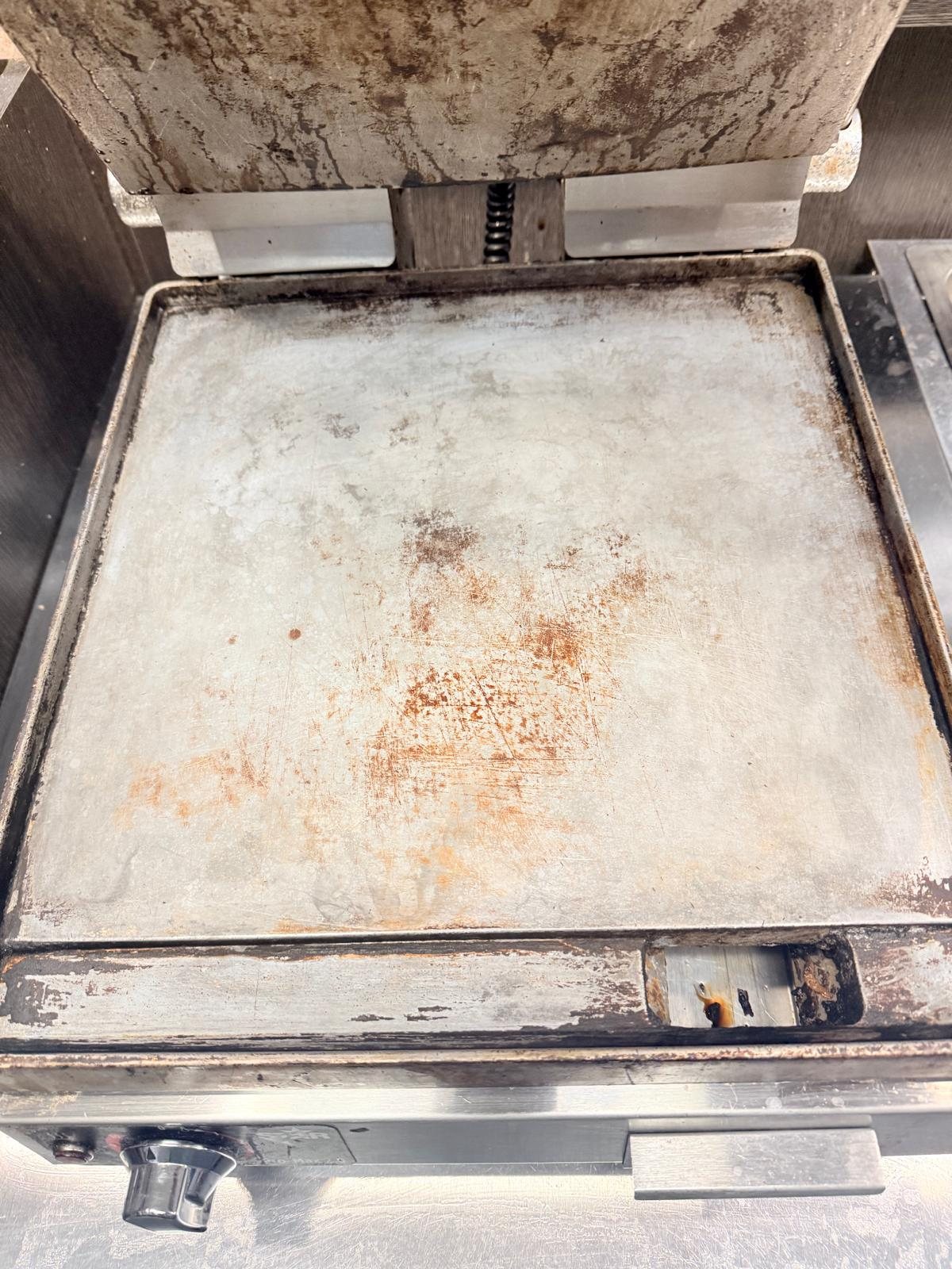 Commercial griddle after documented VIVE-GRILL application